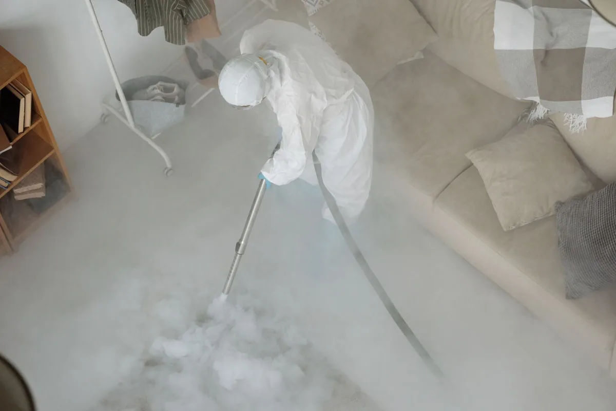 Biohazard cleanup technician in protective equipment, Finneytown, OH